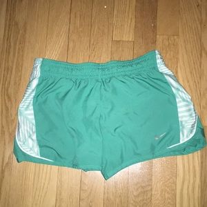 Green Nike running shorts